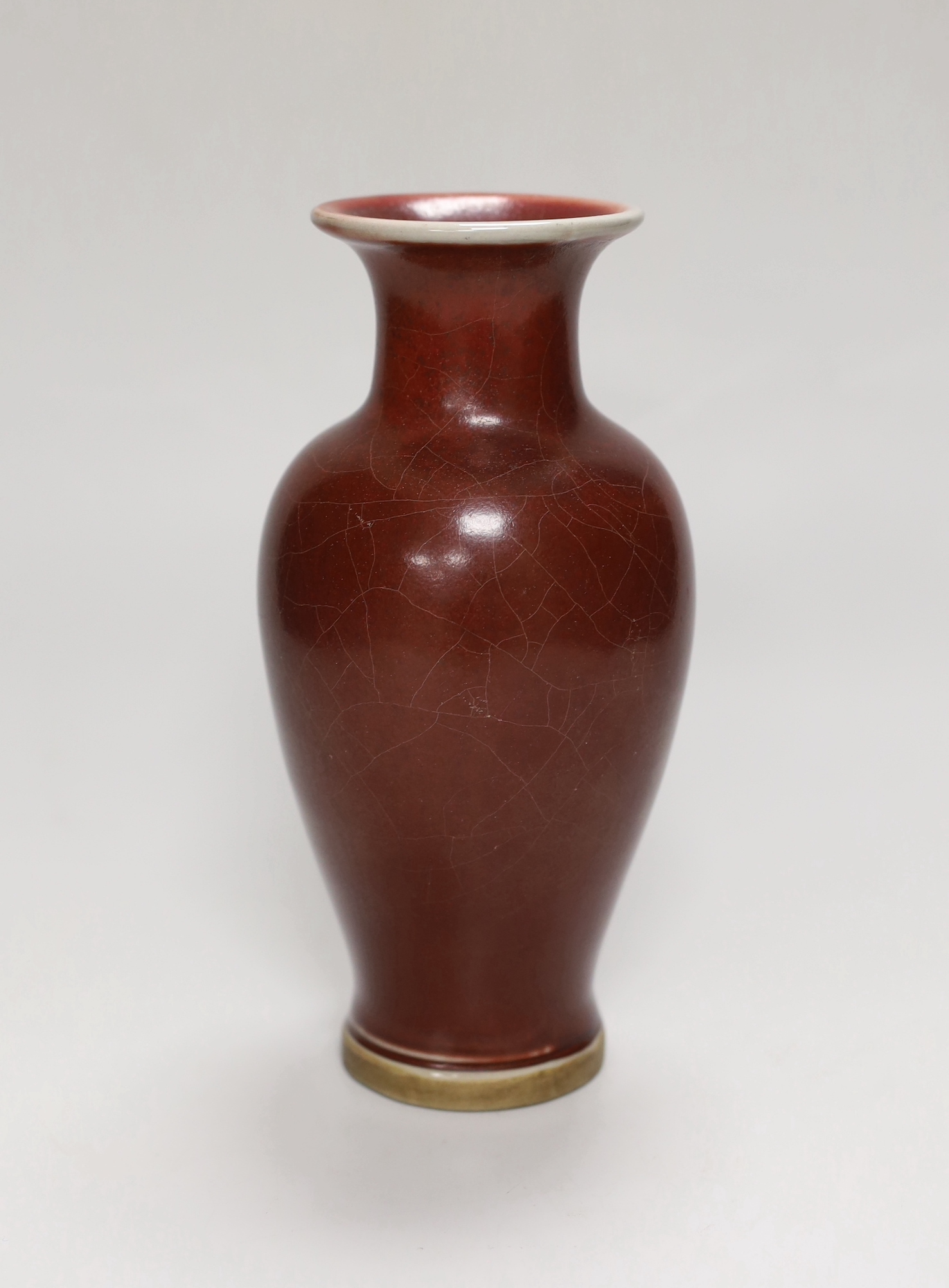 A Chinese sang de boeuf baluster vase, 18.5cm